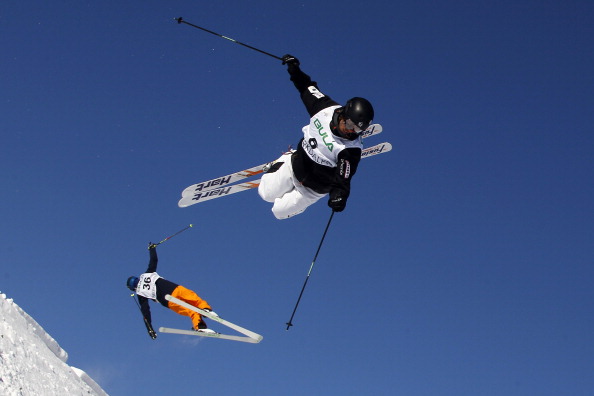 Philippe Marquis (R) of Canada and Ville Miettunen of Finland compete during the FIS Freestyle Ski World Championship Men's and Women's Dual Moguls on March 08, 2013 in Voss, Norway. 