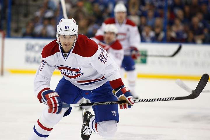Max Pacioretty #67 of the Montreal Canadiens races down ice for the puck against the Tampa Bay Lightning during the first period at Tampa Bay Times Forum on December 28, 2013 in Tampa, Florida.