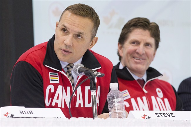 Team Canada Olympic hockey team Executive Director Steve Yzerman and head coach Mike Babcock, right, speak following the announcement of the team roster in Toronto, Tuesday January 7, 2014. 