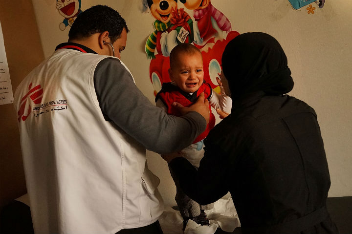 a doctor in a health clinic for refugees operated by Doctors Without Borders/Medecins Sans Frontieres