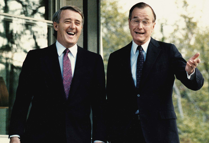 This file photo from April 28, 1988, shows former US Vice President George Bush (R) as he shares a laugh with Canada's former Prime Minister Brian Mulroney.