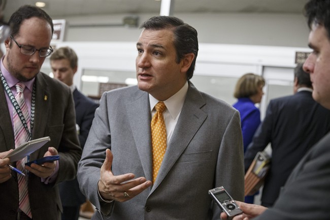 In this Dec. 17, 2013 file photo, Sen. Ted Cruz, R-Texas, speaks with reporters on Capitol Hill in Washington.