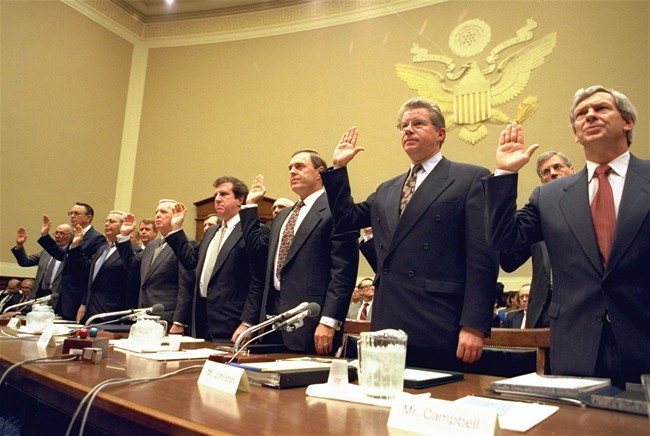 In this Thursday, April 14, 1994 file photo, heads of the nation's largest cigarette companies are sworn in before a hearing of a House Energy subcommittee which was holding hearings on the contents of cigarettes on Capitol Hill in Washington. 