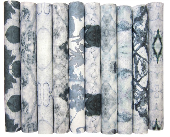 This photo provided by Eskayel shows rolls of shibori fabric produced by Eskayel, a design firm based in New York. The home-design purveyor is creating the look of shibori patterns using ink, water and watercolors, followed by digital printing techniques. 