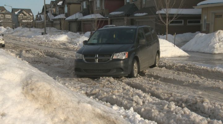 A van gets stuck in the snow in southwest Edmonton Thursday, Jan. 16, 2014.