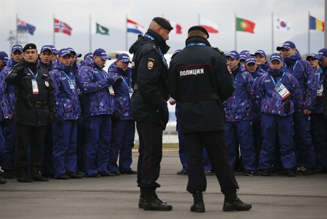 Russian security personnel wait for deployment in the Olympic Park as security measures continue to be implemented for the 2014 Winter Olympics, Thursday, Jan. 30, 2014, in Sochi, Russia. 