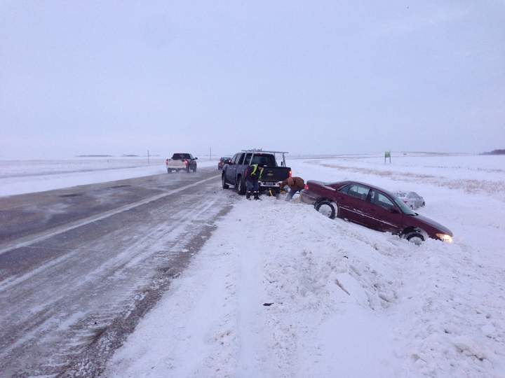 A vehicle is pulled from the ditch alongside the Perimeter Highway south of Fermor Avenue on Thursday morning.