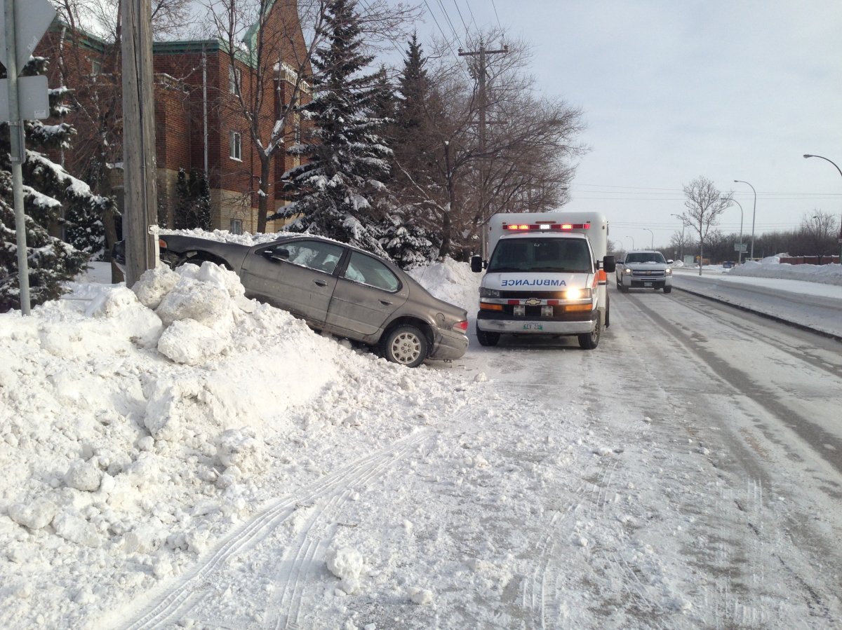 A car wound up on a snowbank on Grant Avenue in Winnipeg on Monday, January 6, 2014.