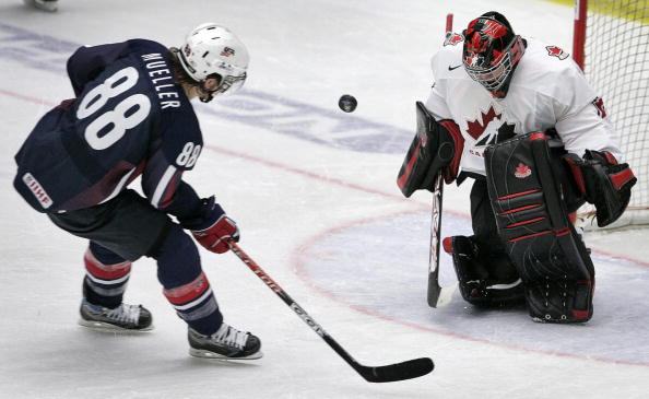 Team Canada's goalie Carey Price saves the last shot from Team USA's Peter Mueller (88) in the penalty shootout during the semifinal match USA vs Canada at the World U20 hockey championship 03 January 2007 in Leksand, Sweden.