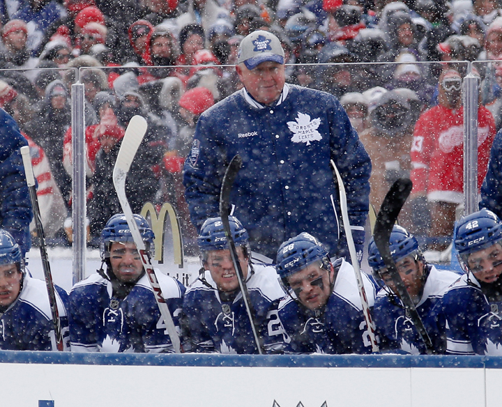Head coach Randy Carlyle of the Toronto Maple Leafs watches the action against the Detroit Red Wings in the first period of the 2014 Bridgestone NHL Winter Classic at Michigan Stadium on January 1, 2014