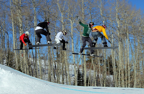 Chris Robanske (in green) of Canada races during the final heat of the Men's Snowboarder X at Winter X Games 15 at Buttermilk Mountain on January 29, 2011 in Aspen, Colorado. 