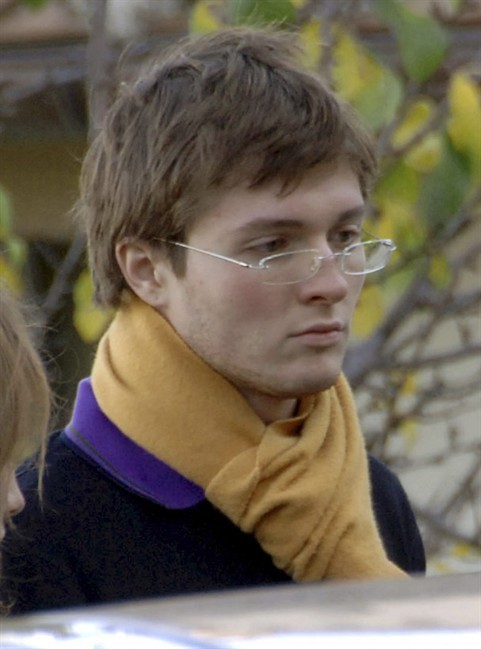 FILE - In this Nov. 2, 2007 file photo, Italian student Raffaele Sollecito, then boyfriend of American student Amanda Knox, stands outside the rented house where 21-year-old British student Meredith Kercher was found dead on Nov 1, in Perugia, Italy.