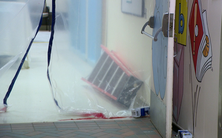 Cold causes burst pipe: Saskatoon's Royal University Hospital wall exposed by construction.