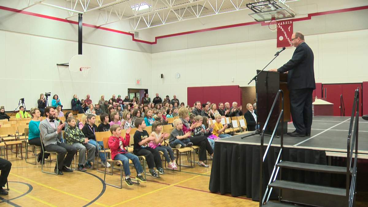Infrastructure Minister Ric McIver delivers modernization plans on behalf of the AB government to six schools in southern Alberta.