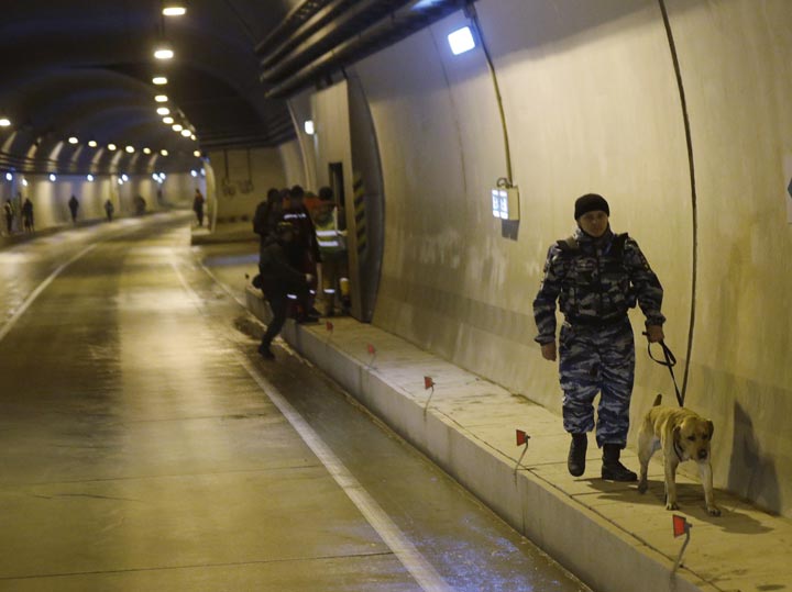Russian police inspect a tunnel on the road between and Krasnaya as increased security measures are put into place ahead of the 2014 Winter Olympics, Thursday, Jan. 30, 2014, in Krasnaya Polyana, Russia. 