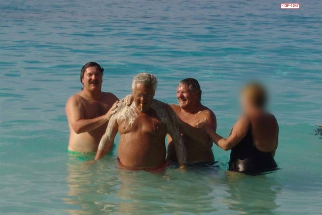 A photograph of a high-powered union boss having his back washed by a construction magnate while on vacation caused a stir at Quebec's corruption inquiry on Monday, Jan. 20, 2014. The 2005 photo entered into evidence shows businessman Tony Accurso scrubbing the back of Jean Lavallee, a former head of the construction wing of Quebec's biggest labour federation.