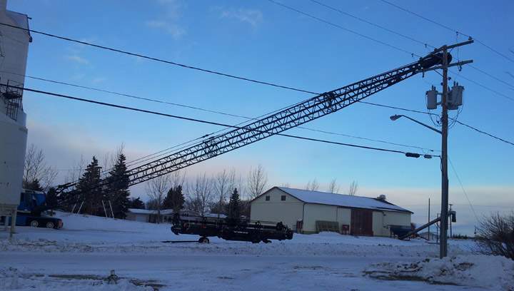 Wind may have toppled a crane on to power lines in Rosthern, knocking out power to the community for several hours on Jan. 15. 2014.