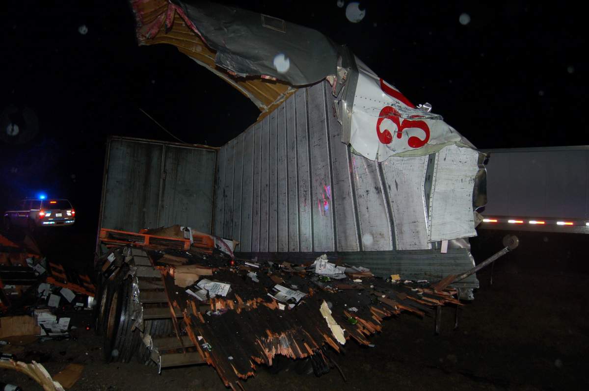 Police say a 30-year-old Abbotsford male was operating a Kenworth semi-trailer filled with wine, headed eastbound on Highway #1 when he lost control of the vehicle and drove through the centre median of the highway. Credit: RCMP handout