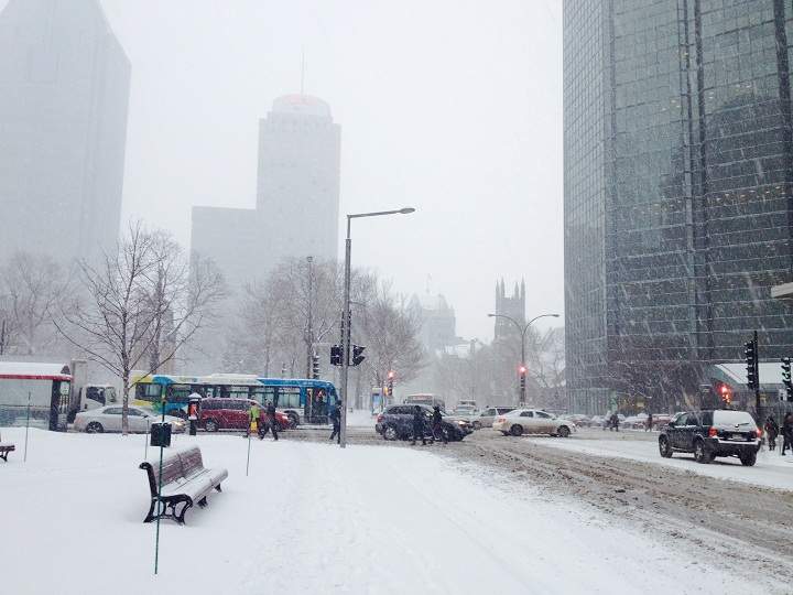 Traffic and snow in downtown Montreal on January 27, 2014.