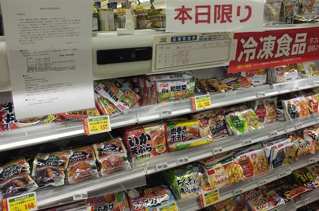 In this Tuesday, Jan. 7, 2014 photo, the notice of apology and recall is placed on the shelves of frozen food products at a supermarket in Fujisawa, near Tokyo. 