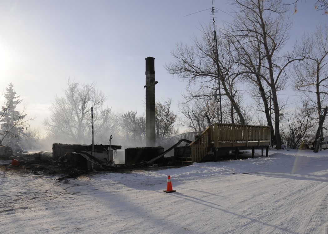 Photograph of Klaus residence in Castor, Alberta, at the end of the fire.