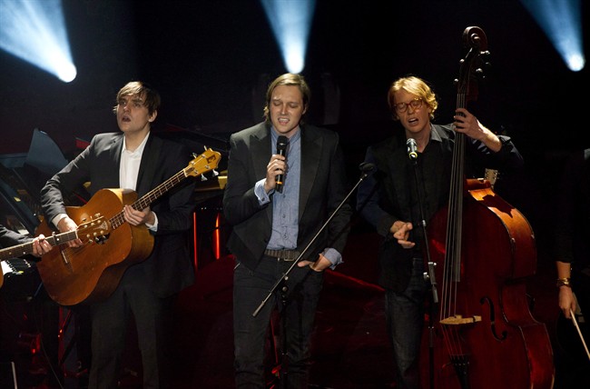 Arcade Fire performs during a benefit concert Monday, October 1, 2012, in Montreal. Montreal's Arcade Fire has nabbed a leading six Juno nominations Tuesday, Feb. 4, 2014. THE CANADIAN PRESS/Paul Chiasson.