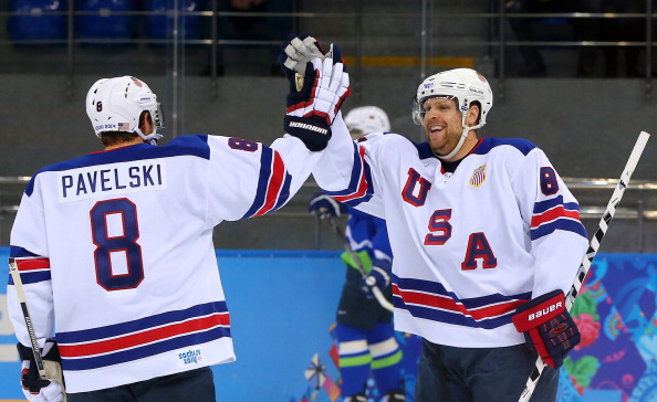 Phil Kessel #81 of the United States celebrates with Joe Pavelski #8 of the United States after scoring his second goal in the first period against Slovenia, both assisted by Pavelski, during the Men’s Ice Hockey Preliminary Round Group A game on day nine of the Sochi 2014 Winter Olympics at Shayba Arena on February 16, 2014 in Sochi, Russia.