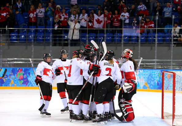 Canada celebrates after winning the game during the Women's Ice Hockey Playoffs Semifinal game 3-1 against Switzerland on day ten of the Sochi 2014 Winter Olympics at Shayba Arena on February 17, 2014 in Sochi, Russia.  
