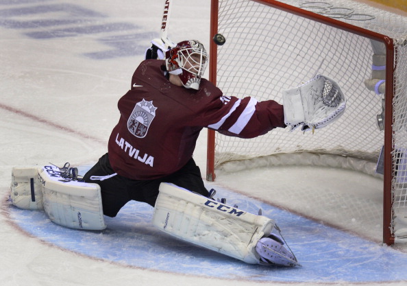 Latvia's goalkeeper Kristers Gudlevskis saves his net during the Men's Ice Hockey Quarterfinals Canada vs Latvia at the Bolshoy Ice Dome during the Sochi Winter Olympics on February 19, 2014. 