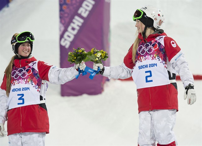 Canada’s Justine Dufour-Lapointe (right) celebrates with her sister Chloe Dufour-Lapointe after winning the gold and silver medal respectively.