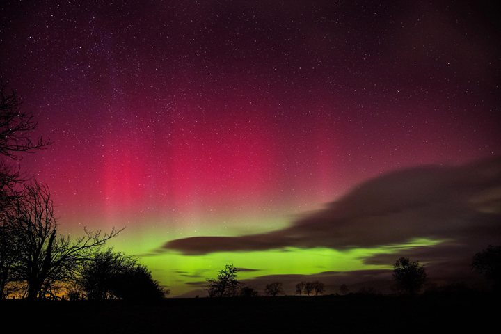 In this photo taken late Thursday Feb. 27, 2014, the  aurora borealis, or northern lights, illuminate the night sky at Embleton Bay in Northumberland, England on Feb. 27, 2014.