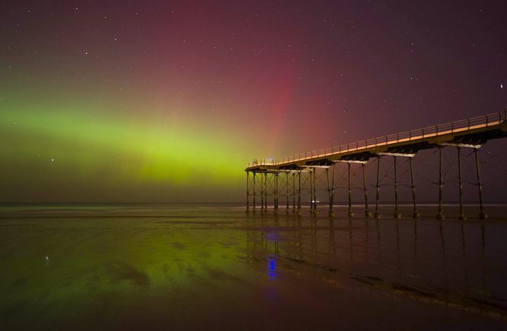 The aurora borealis is visible over the Victorian Pier in Saltburn by the Sea in Cleveland, England on Feb. 27, 2014.