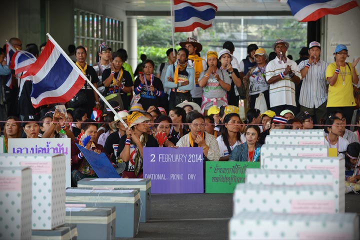Anti-government protesters gather in front of ballot boxes in preventing voting at a polling station in Thailand's general election on February 2, 2014 in Bangkok, Thailand. 