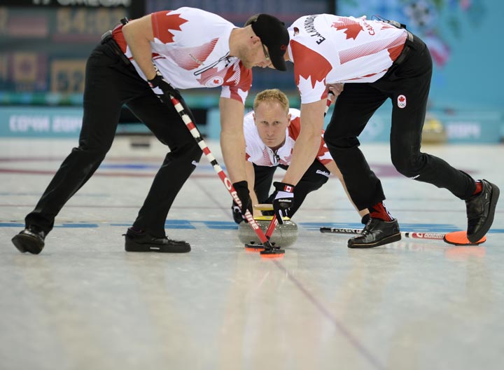 Canada's Brad Jacobs releases a rock during the 2014 Sochi Winter Olympics men's curling round robin match against Germany at the Ice Cube in Sochi on February 10, 2014. 
