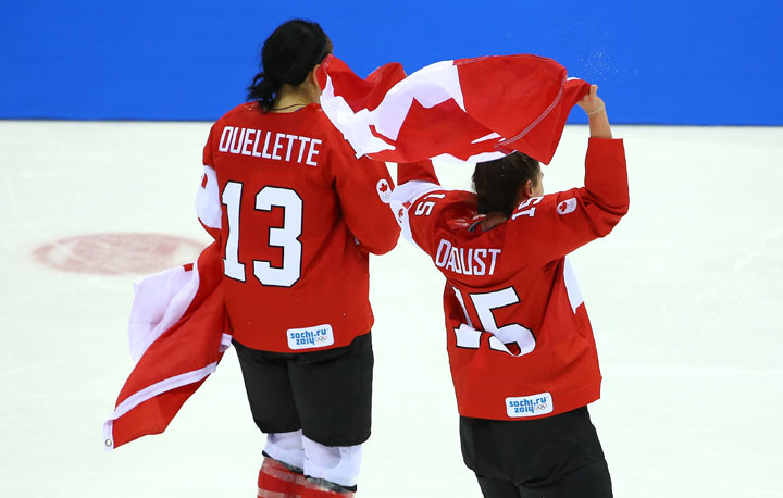 USA defenseman Anne Schleper (15) cross checks Canada forward Jayna Hefford  (16) in the second period of the women's hockey gold medal game at the  Bolshoy Ice Dome during the Winter Olympics