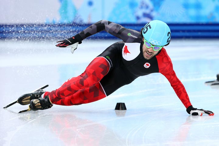 Charles Hamelin of Canada falls while competing in the Short Track Men's 500m Heat at Iceberg Skating Palace on day 11 of the 2014 Sochi Winter Olympics on February 18, 2014 in Sochi, Russia.  