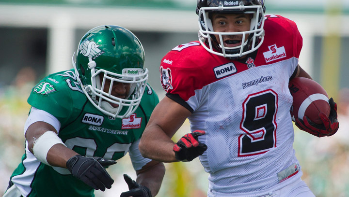 Calgary Stampeders running back Jon Cornish (#9) is chased by Saskatchewan Roughriders linebacker Shomari Williams (#99) during CFL action between the teams on Saturday August 25, 2012.
