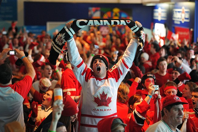 Fans in Canada House cheer Canada's 3-2 gold medal ice hockey victory over the USA Sunday, Feb. 28, 2010 at the 2010 Vancouver Olympic Winter Games.