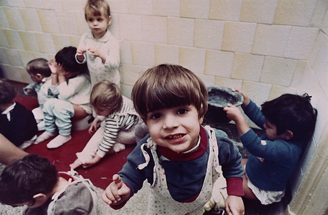 Romanian orphans play without toys at Bucharest's Number one Orphanage in Bucharest, Romania, February 14, 1991. After the Iron Curtain was torn down almost 25 years ago, childless western couples flooded into Romania looking to adopt.