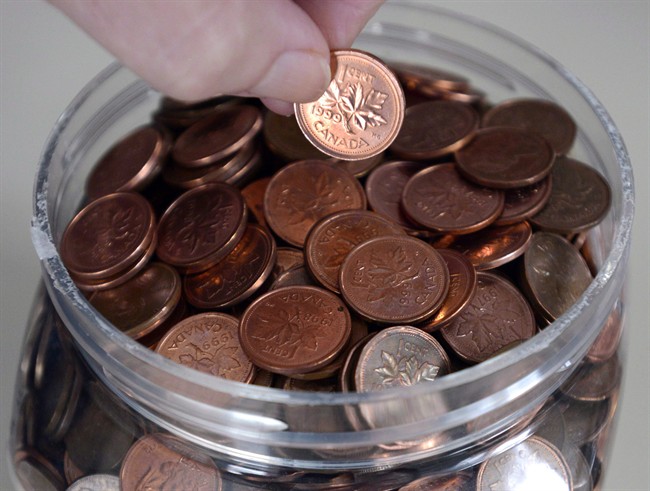 A household penny jar is shown in Montreal, Monday, February 4, 2013.When it comes to balancing the country's books, it's the equivalent of finding loose change under a couch cushion.