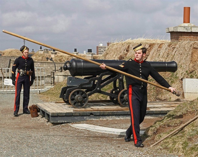 Members of the 78th Highlanders prepare to fire the noon gun on Citadel Hill in Halifax on Monday April 10, 2006. Parks Canada's crumbling forts, historical houses and other heritage structures are in much poorer shape than the agency estimates. 