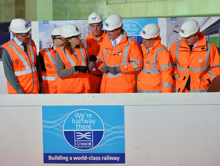 Britain's Prime Minister David Cameron (4th R) and Mayor of London Boris Johnson (2nd R) are pictured during a visit to a Crossrail construction site underneath Tottenham Court Road in central London, on January 16, 2014. The Crossrail project, which is expected to be completed in 2018, will link Berkshire, west of London with Essex, east of London.