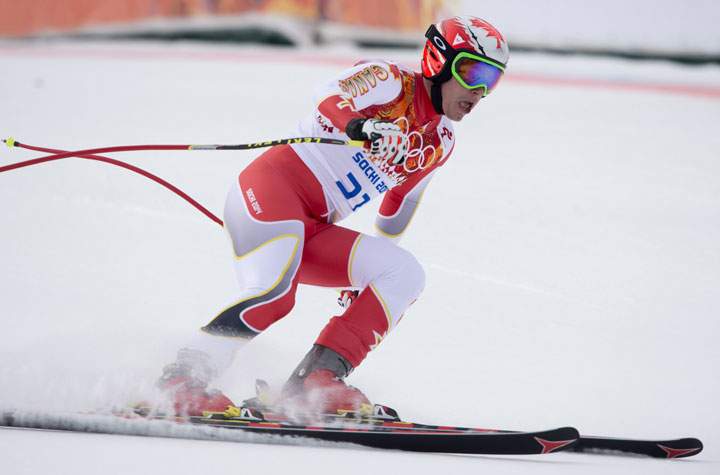 Canada's Erik Guay reacts to his 10th place finish following his run during the Men's Downhill final at the Sochi Winter Olympics in Krasnaya Polyana, Russia, Sunday, Feb. 9, 2014. 