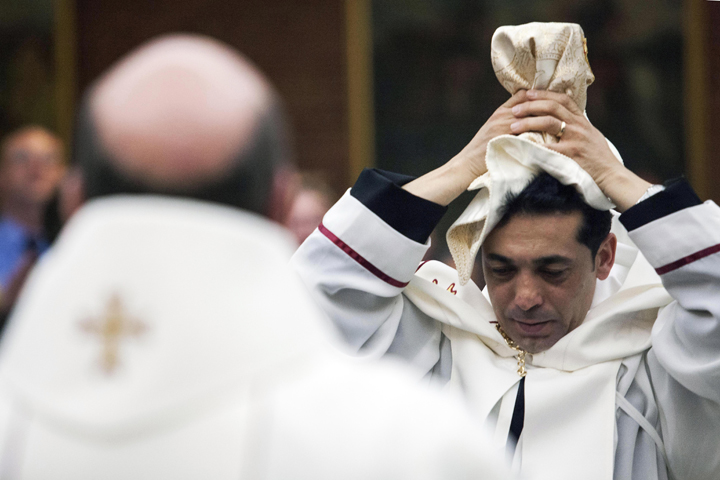 Deacon Wissam Akiki, who is married, is ordained to the priesthood during a ceremony at St. Raymond’s Maronite Cathedral Thursday, Feb. 27, 2014, in St. Louis. 