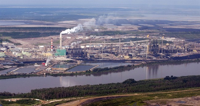 An oilsands mine facility sites along the Athabasca river near Fort McMurray, Alta., in a July 10, 2012 photo.