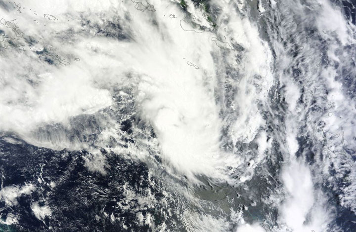 Tropical storm Edna is heading towards Queensland, Australia at the same time the region warns of fire threat.