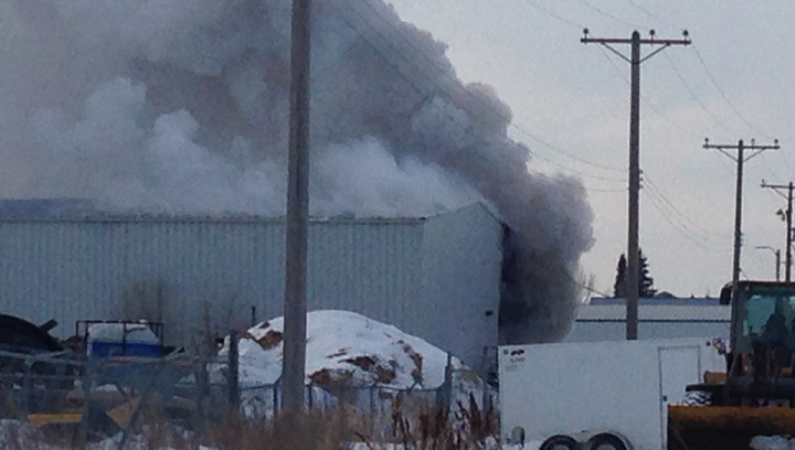 Dozens of firefighters are battling a large blaze in a warehouse in the Sutherland Industrial neighbourhood.
