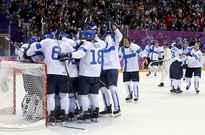 Team Finland celebrates after beating the USA 5-0 in the men's bronze medal ice hockey game at the 2014 Winter Olympics