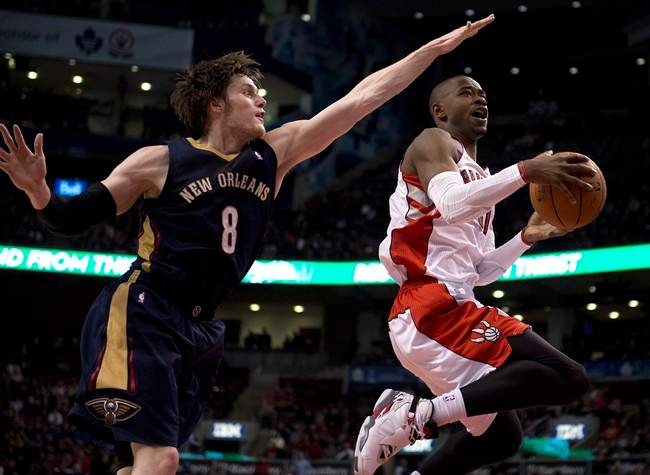 Toronto Raptors guard Terrence Ross (right) drives to the hoop past New Orleans Pelicans forward Luke Babbitt (8) during fourth quarter NBA action in Toronto on Monday February 10, 2014. 
