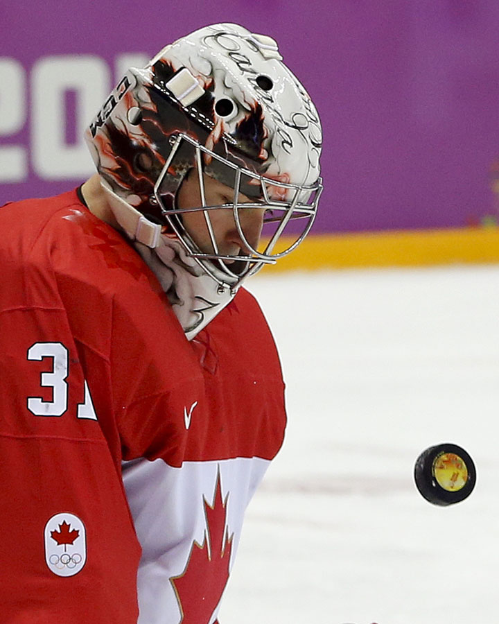 Canada goaltender Carey Price blocks a shot by Sweden during the first period of the men's gold medal game